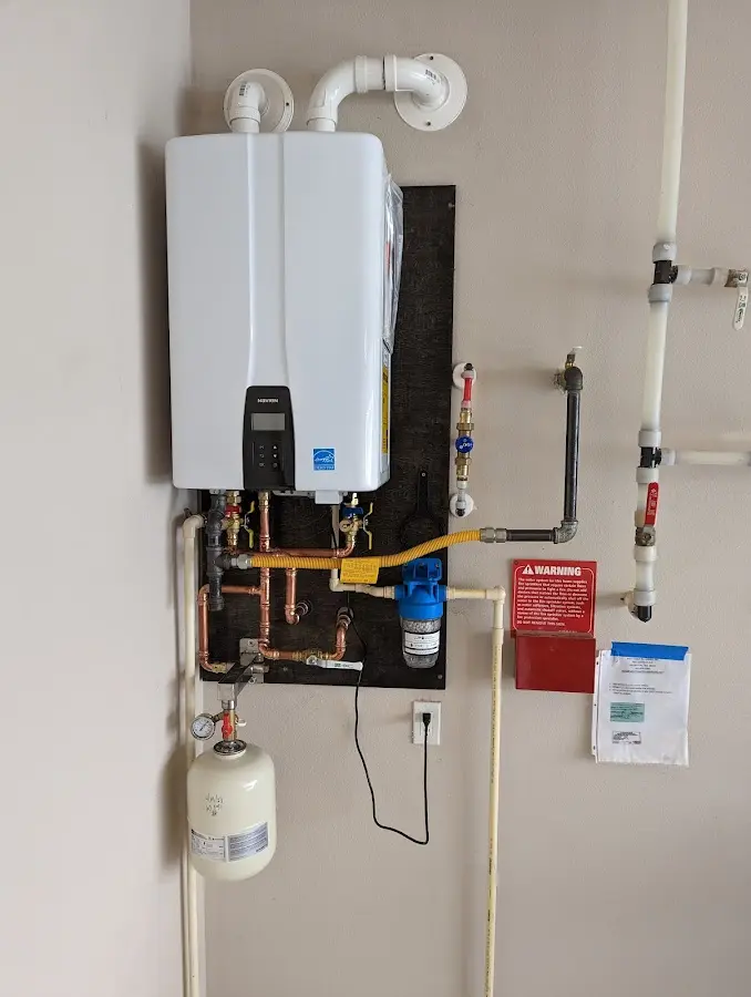 Professional plumber installing copper piping in a Hartselle home